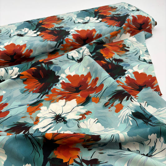 Rayonstoff - blau mit gebranntorangem Blumenmuster (Meterware)