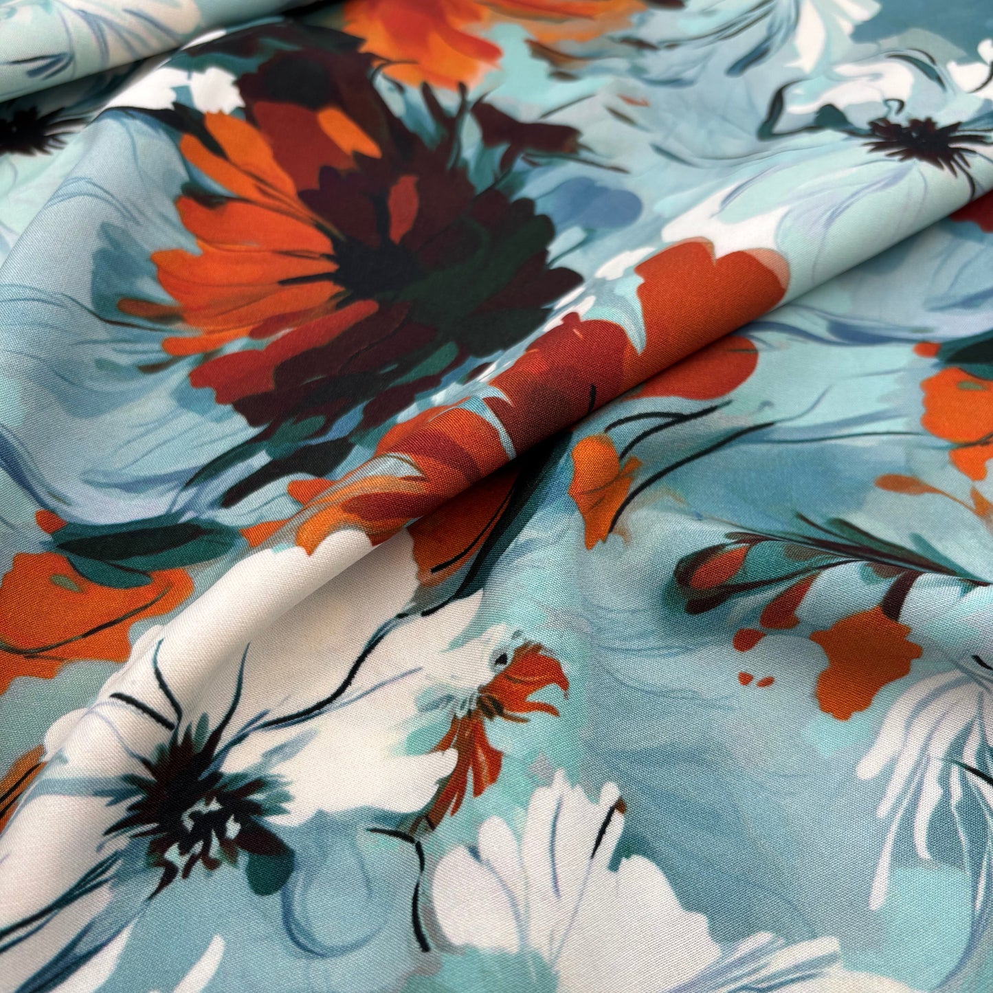 Rayonstoff - blau mit gebranntorangem Blumenmuster (Meterware)