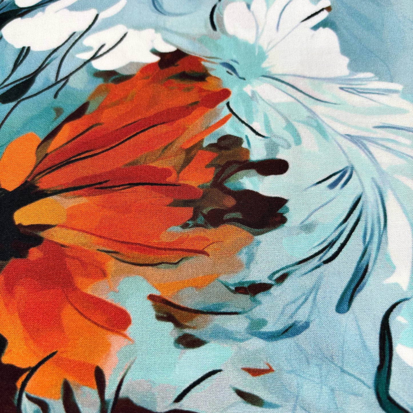 Rayonstoff - blau mit gebranntorangem Blumenmuster (Meterware)